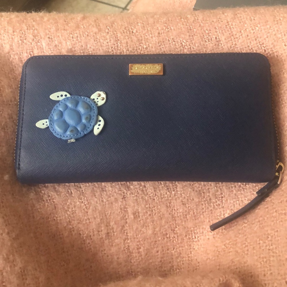 Kate spade turtle wallet!! Very well loved wallet